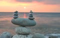 Zen stones on beach at sunrise Royalty Free Stock Photo