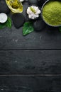 Zen stones and leaves with water drops. Spa background with spa accessories on a dark background. Top view. Free space Royalty Free Stock Photo