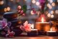 Zen stones, orchid flowers and aromatic candles spa arrangement on wooden table Royalty Free Stock Photo