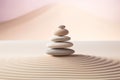 Zen stones stack on raked sand in a minimalist setting for balance and harmony Royalty Free Stock Photo