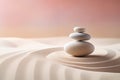 Zen stones stack on raked sand waves in a minimalist setting for balance and harmony Royalty Free Stock Photo