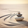 Zen stones stack on raked sand waves in a minimalist setting for balance and harmony Royalty Free Stock Photo