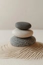 Zen Stones Stacked On Sand, Creating A Serene Minimalist Background With Ample Copy Space. Royalty Free Stock Photo