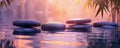 Zen stones in still water with bamboo leaves and a warm sunset glow. Spa and wellness concept design for poster Royalty Free Stock Photo