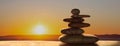 Zen stones on sunrise background. 3d illustration