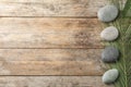 Zen stones and tropical leaf on wooden background