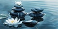 Zen stones, water lily, lotus symmetrically aligned against calm water. Self care, yoga training, fitness, breathing exercises, Royalty Free Stock Photo