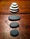 Zen stones on a weathered antique table.