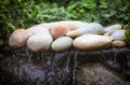 Zen waterfall. Soft image of stones over moving water.