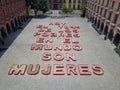 Zenith view of giant letters in Caudillos Square, Today 70% of the poor in the world are women