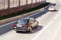 Zenith view of Mercedes Benz E Class W213 car racing on highway road