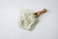 Zeolite raw powder and spoon on white background