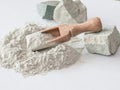 Zeolite raw powder and stones on white background