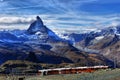 Famous electric red tourist train coming down in Zermatt