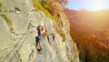 Zermatt, Switzerland, June 1, 2020: Two sportsman mountain climbing in Switzerland against a beautiful landscape. Two men climb