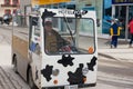 Man drives electric delivery car by the street of Zermatt, Switzerland.