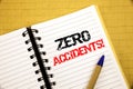 Zero Accidents. Business concept for Safety At Work Hazard written on notepad with copy space on old wood wooden background with p Royalty Free Stock Photo