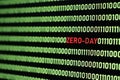 ZERO-DAY text and binary code concept from the desktop computer screen. Royalty Free Stock Photo