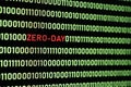 ZERO-DAY text and binary code concept from the desktop computer screen. Royalty Free Stock Photo