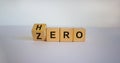 From zero to hero concept. Hand turns a cube and changes the word `zero` to `hero`. Beautiful white background. Concept. Copy Royalty Free Stock Photo