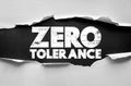 ZERO TOLERANCE message on torn paper background. Strong bold letters symbolize strict rules, workplace policies, discipline, Royalty Free Stock Photo