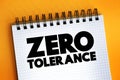 Zero Tolerance text on notepad, concept background