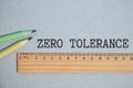 ZERO TOLERANCE. text on white paper on gray background Royalty Free Stock Photo