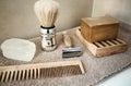 Zero waste bathroom accessories for men. Wooden comb, potassium alum salt deodorant, aleppo soap and solid shampoo, bamboo and