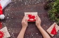 Zero waste Christmas , concept. Handmade gifts made of Kraft paper, thread and natural red felt.Surprise.Without plastic. DIY. Royalty Free Stock Photo