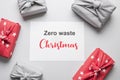 Zero waste Christmas. Sustainable gifts wrapped in red and grey textile. Xmas eco holiday. Japanese Furoshiki style. View from