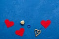 Zero waste concept. environmentally friendly different hearts wooden, straw, linen on a blue background. Congratulations on
