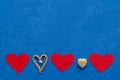Zero waste concept. environmentally friendly flax hearts, wooden, straw on a blue background. Congratulations on Valentine`s Day,