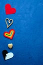 Zero waste concept. environmentally friendly flax hearts, wooden, straw, recycled plastic on a blue background. Congratulations on