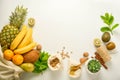 Zero waste concept frame. Food storage. Fruits and cereals in eco textile bags, glass jars with cereals, white background. Copy Royalty Free Stock Photo