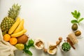 Zero waste concept frame. Food storage. Fruits and cereals in eco textile bags, glass jars with cereals, white background. Copy Royalty Free Stock Photo