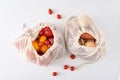 Zero waste concept. Fresh organic vegetables in textile bag on a white background