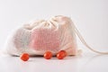 Zero waste concept. Fresh organic vegetables in textile bag on a white background
