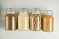 Zero waste concept. Various raw cereals in glass jar. Food storage. Flat lay. White background Royalty Free Stock Photo