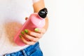 Woman holding reusable water bottle Royalty Free Stock Photo