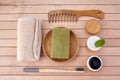 Zero waste flat lay. Bamboo toothbrush, wooden brush on wooden background. Eco products plastic free