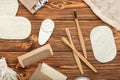 Zero waste home product. Bamboo toothbrushes, soap, Cotton Swabs Wooden Sticks,loofah washcloths on wooden background.Natural bath