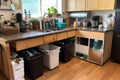 zero-waste kitchen, with compost bin and recycling containers visible