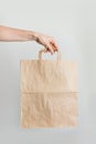 Zero waste. Paper shopping bag in women`s hand