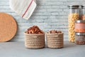 Zero waste plastic-free kitchen, eco-friendly food storage, dried fruits and nuts in jute baskets, cereals and pasta in glass jars