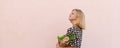 Zero waste. Portrait of Young woman in summer dress with a paper craft eco bag of vegetables and baguette. Sustainable Royalty Free Stock Photo