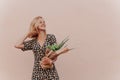 Zero waste. Portrait of Young woman in summer dress with a paper craft eco bag of vegetables and baguette. Sustainable Royalty Free Stock Photo