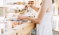 Zero waste shop. Woman buying dry goods in plastic free grocery store Royalty Free Stock Photo