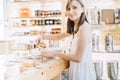 Zero waste shop. Woman buying dry goods in plastic free grocery store Royalty Free Stock Photo