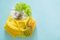 Zero waste shopping concept - groceries and reusable bags on blue background Royalty Free Stock Photo