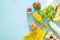 Zero waste shopping concept - groceries and reusable bags on blue background Royalty Free Stock Photo